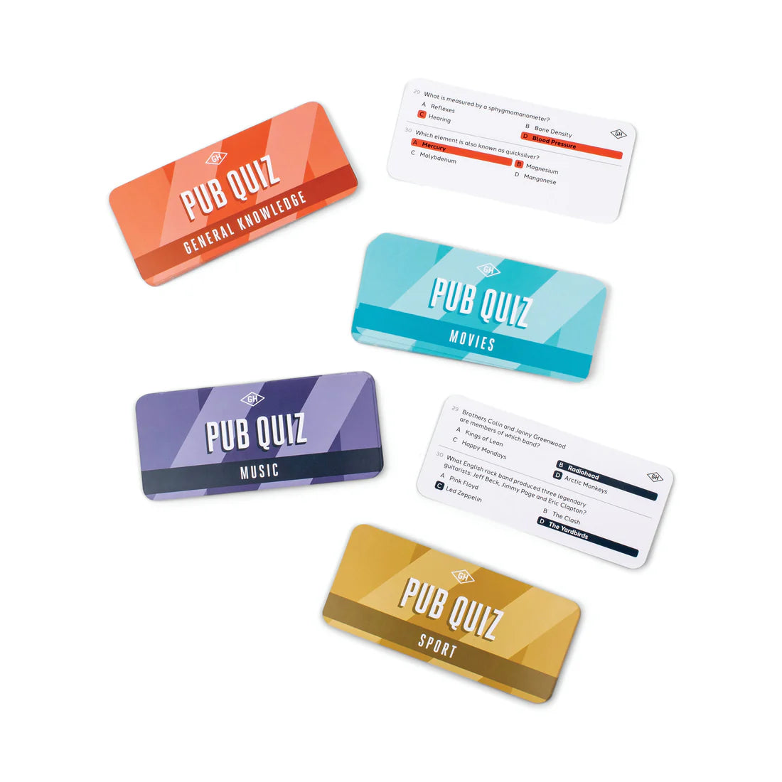 Pub Quiz in a Can trivia cards spread out by category—movies, sport, music, and general knowledge—compact quiz game for parties and gifts