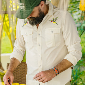 Man wearing Gaucho Snapshirt Nectar Seekers cream Western shirt