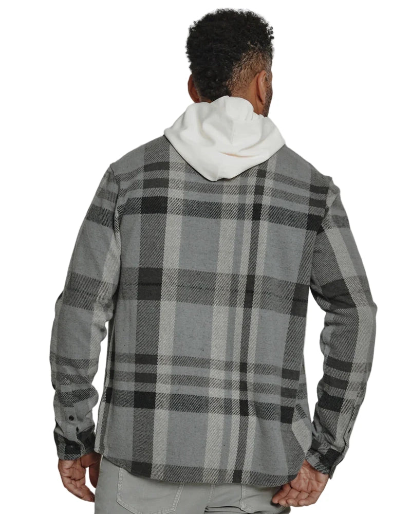 Back view of Generation Plaid Shirt in grey, layered over white hoodie, showing plaid pattern and curved hem