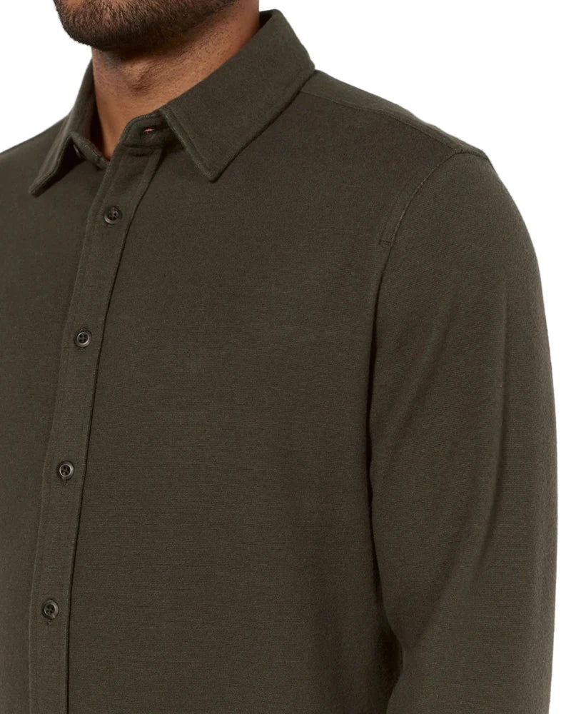 Detailed view of Generation Solid Shirt collar, buttons, and shoulder seam in olive green