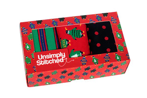 Penguin Ugly Sweater Party 3-pair men’s sock gift box by Unsimple Stitched, featuring festive holiday designs, available at The Simple Man.