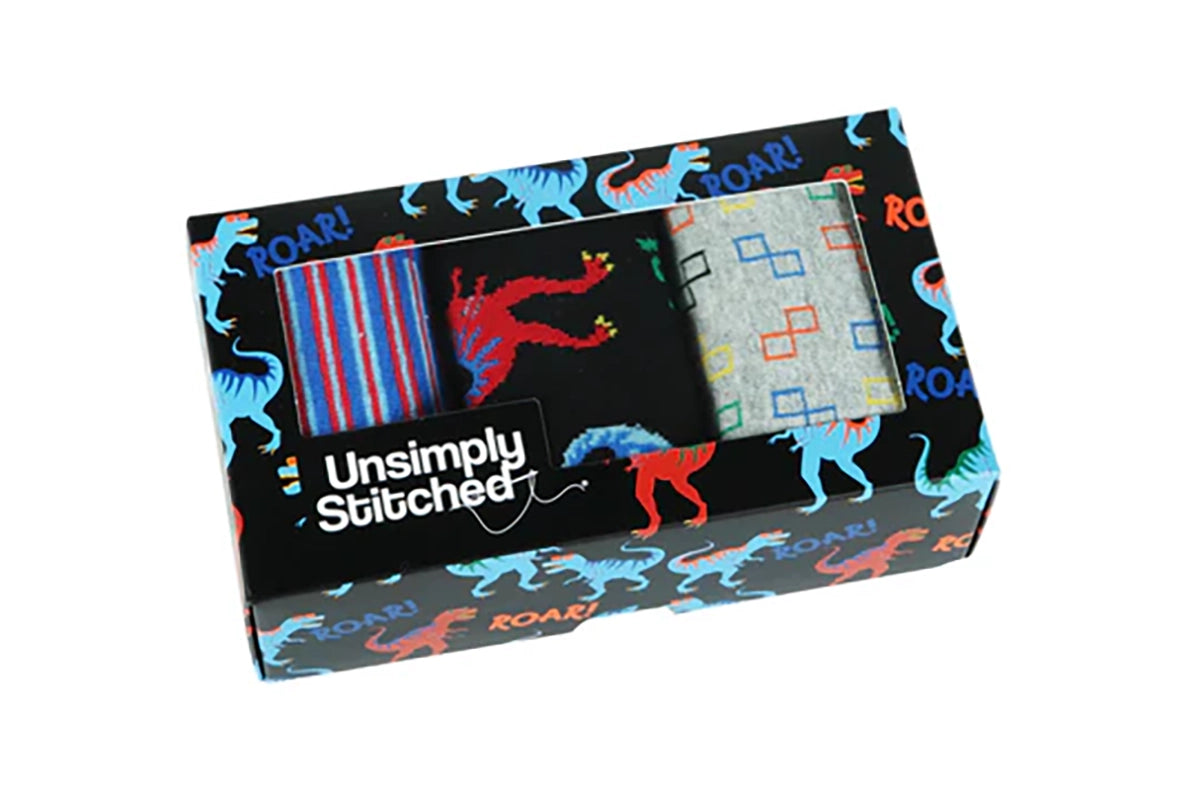 T-Rex Roar men’s sock gift box by UnsimpIy Stitched, featuring three colorful pairs displayed in dinosaur-themed packaging from The Simple Man.