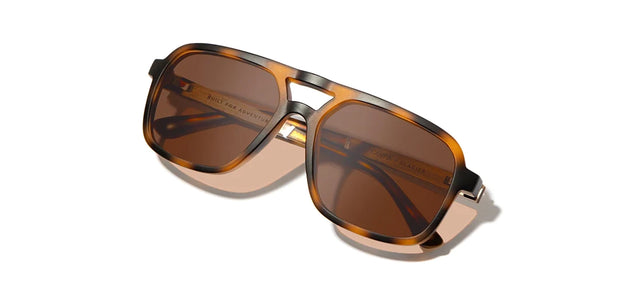 Camp Glacier Sunglasses with Matte Tortoise / walnut frames and brown polarized lenses, front angled closed temple view