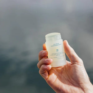 Oars + Alps Go stick Clear Sunscreen stick with the lid off
