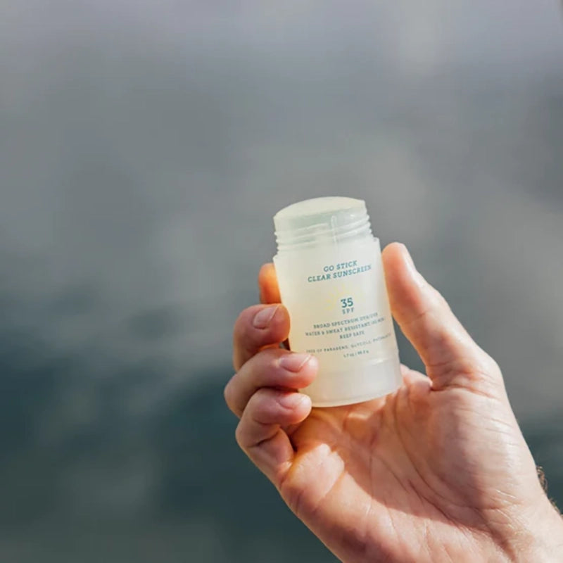 Oars + Alps Go stick Clear Sunscreen stick with the lid off