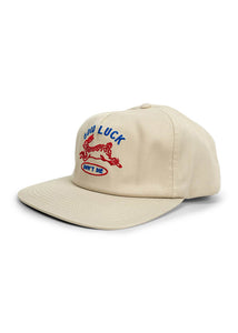 Men’s tan cotton twill hat with Good Luck embroidery