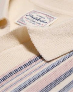 Flag and Anthem Grady Sweater Polo close-up – oatmeal knit fabric with navy pink stripe detail and woven brand label spread collar