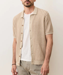 Man wearing Graham Sweater Button Down in taupe with short sleeves and resort collar, layered over a white tee