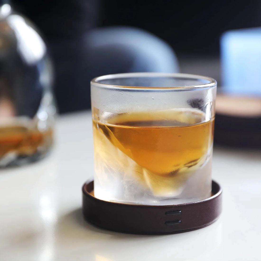 Grand Canyon crystal whiskey glass filled with bourbon on leather coaster – LIITON glass from The Simple Man Omaha