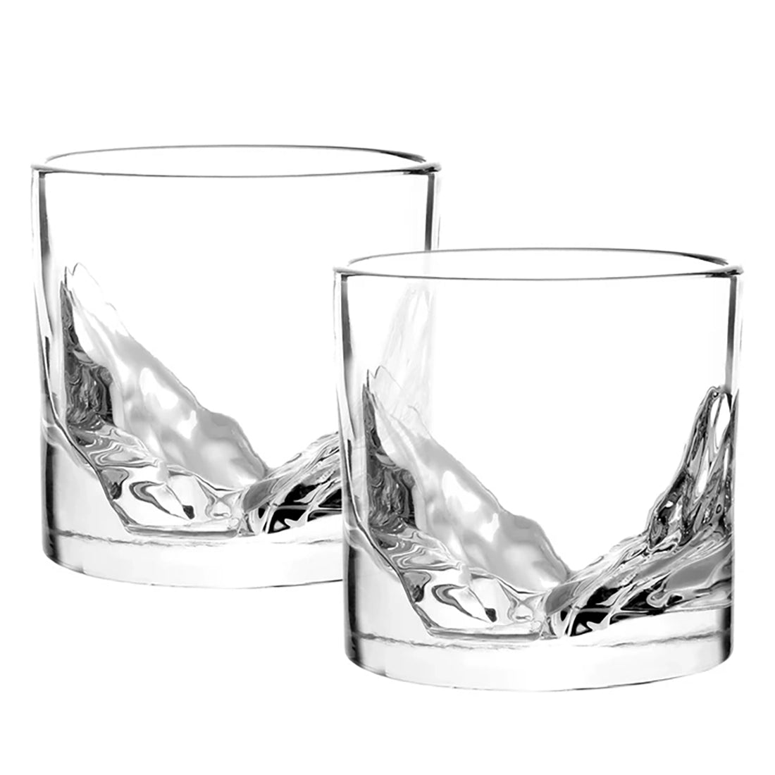 Close-up of two empty LIITON Grand Canyon crystal whiskey glasses showing sculpted mountain base design – The Simple Man Omaha
