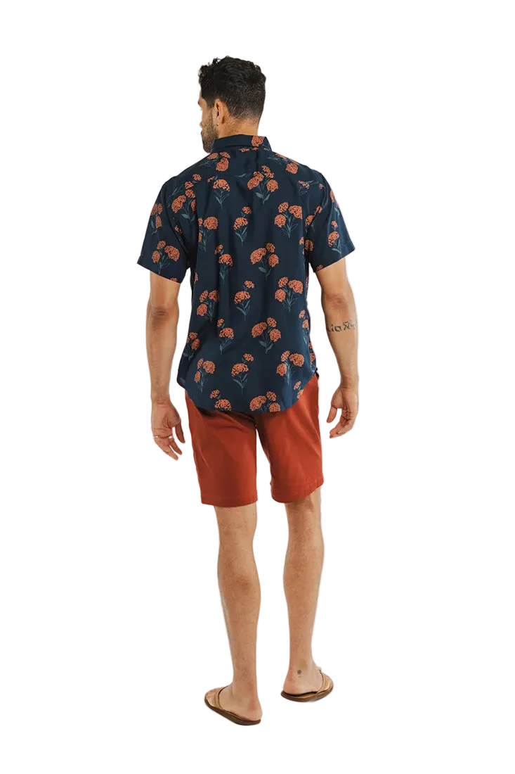 Bridge & Burn Grant Slim Shirt Wildflower Navy – back view on model wearing men's slim fit modal floral button down shirt with rust shorts