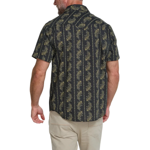 Back view of man wearing the black and olive floral stripe Grampa's Curtains H Bar B Snapshirt, short sleeve western snap shirt -- The Simple Man