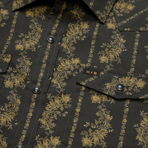Close-up of pearl snap buttons and woven H/B tag on the black and olive floral stripe Grampa's Curtains H Bar B Snapshirt -- The Simple Man