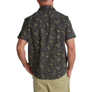 Man wearing Howler Bros H Bar B Snapshirt in Sea Rodeo print back view – charcoal gold western pearl snap short sleeve shirt with chinos