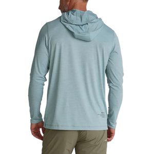 Man wearing Howler Bros HB Tech Hoodie in pool blue back view – UPF 50+ recycled polyester sun hoodie long sleeve lightweight with hood up