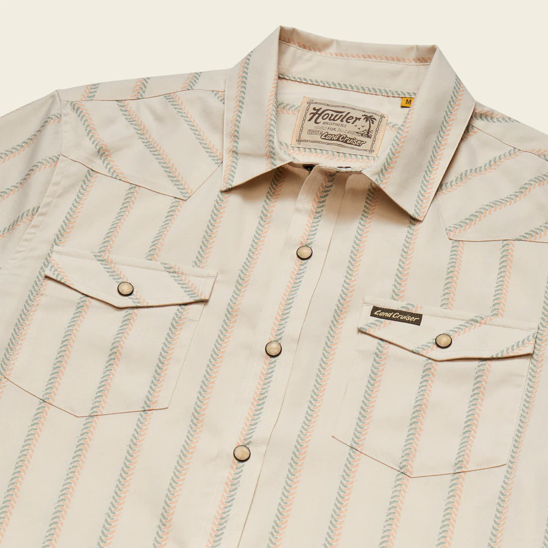 Howler Brothers H Bar B Snapshirt Land Cruiser edition laid flat showing pearl snaps, chest pockets, and custom striped pattern