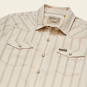 Howler Brothers H Bar B Snapshirt Land Cruiser edition laid flat showing pearl snaps, chest pockets, and custom striped pattern