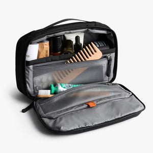 Interior view of the Bellroy black hanging toiletry kit with organized pockets and hook for hanging.