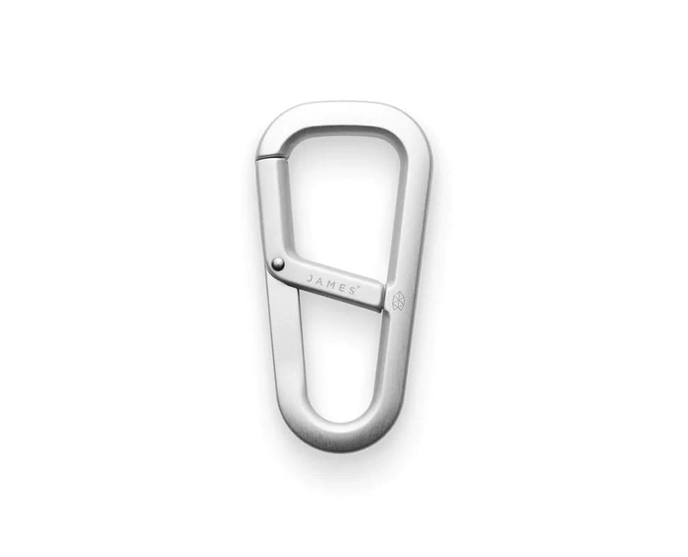 Matte silver forged carabiner with spring-loaded gate, durable and minimalist design for men’s accessories from The Simple Man