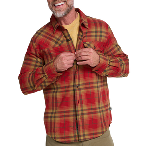 Man in sunglasses wearing the Kempton Plaid Brick Harker's Flannel outdoors by green shrubs, lifestyle shot, The Simple Man