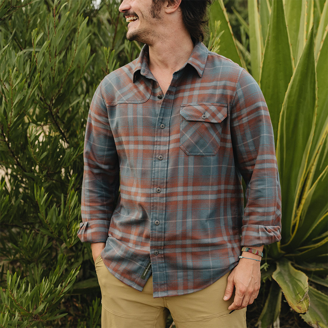 Man wearing the Kempton Plaid Dark Slate Harker's Flannel outdoors with sleeves rolled, The Simple Man