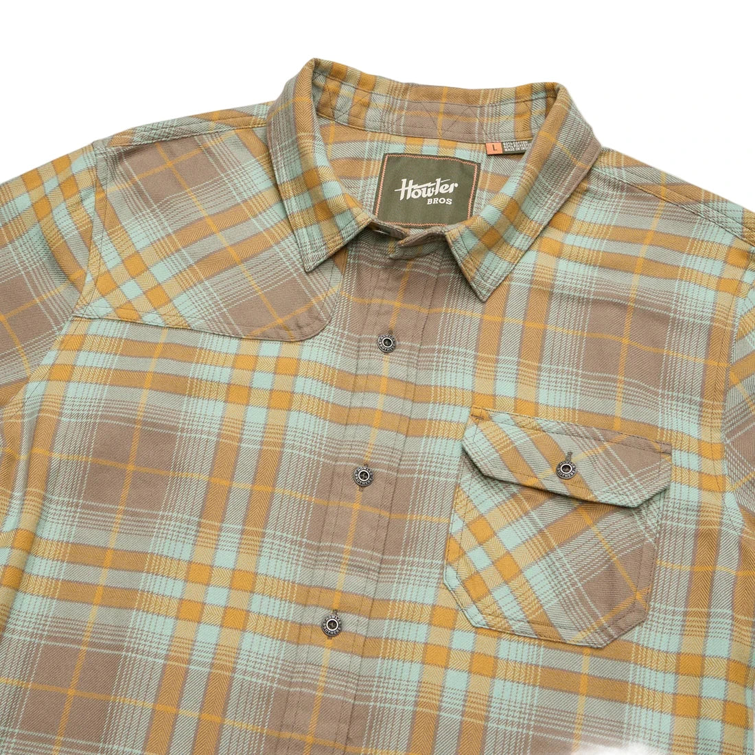 Detailed flat lay of Harker’s Flannel in Kempton Plaid Taupe, featuring chest pocket, metal buttons, and shoulder yoke stitching
