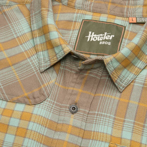 Close-up of Howler Brothers Harker’s Flannel in Kempton Plaid Taupe showing collar detail, soft brushed fabric, and branded label