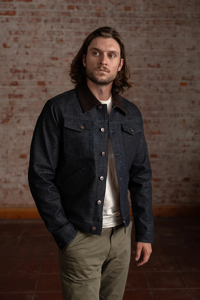 Model wearing Harris selvedge denim jacket front angle
