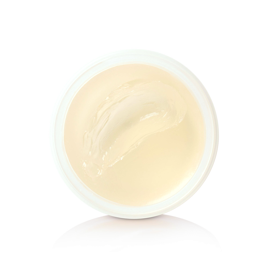 Open jar of cream-colored Heavymade Pomade, top-down detail view