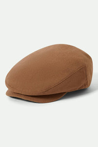 Brixton Hooligan Flat Cap in camel shown in a classic three-quarter view.