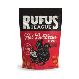 Red and black 9oz pouch of Hot BBQ honey roasted peanuts with a squirrel manning a grill, front view