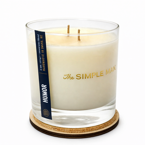 Candle with 'The Simple Man' branding on a white background - HUmor lid Off