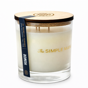 Candle with wooden lid and 'The Simple Man' branding on a white background - Humor Lid on