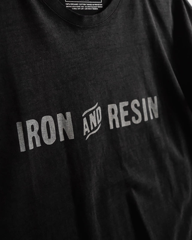 Iron & Resin Logo T-short in black, front close up detail flat lay view