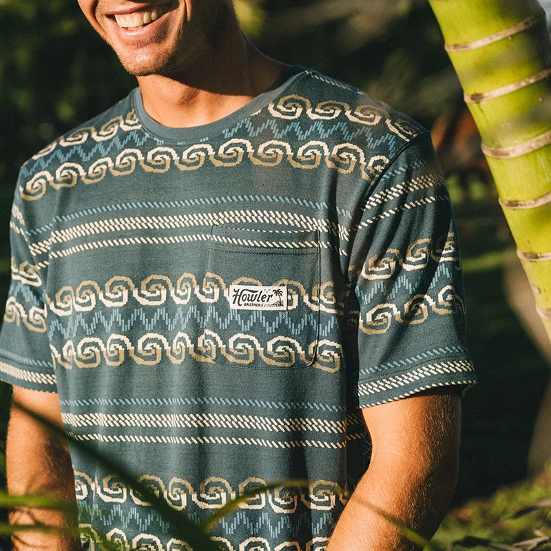 Model wearing Howler Brother's Jacquard T-shirt in Zicatela pattern, front  view