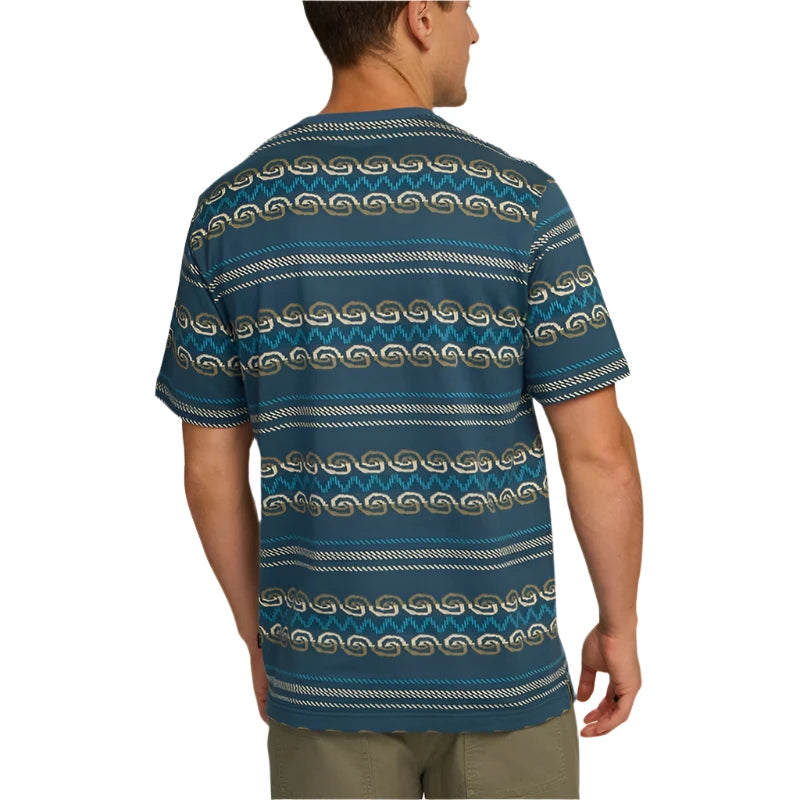 Model wearing Howler Brother's Jacquard T-shirt in Zicatela pattern, rear view