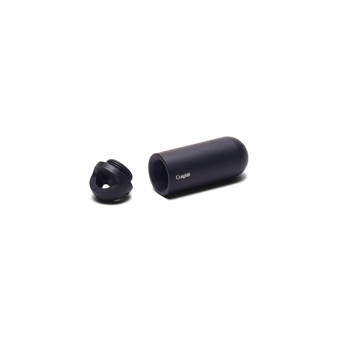 Black anodized aluminum Key Capsule with its threaded lid removed, front view - The Simple Man