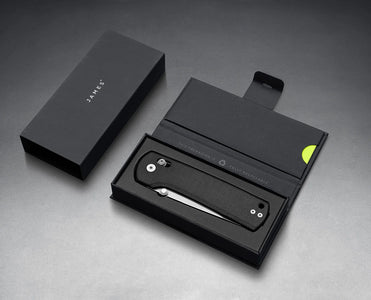 American-made folding knife with MagnaCut steel shown in branded box, black Micarta handle and deep carry clip