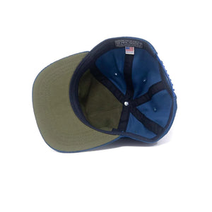 Interior of Ampal Creative blue corduroy snapback with olive brim lining and Made in USA label – The Simple Man