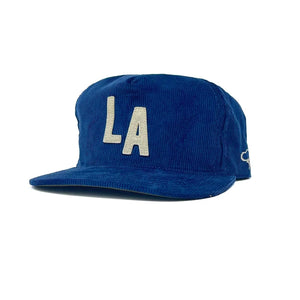 Los Angeles blue corduroy snapback hat with cream LA letter patch, flat brim, 3/4 view – The Simple Man