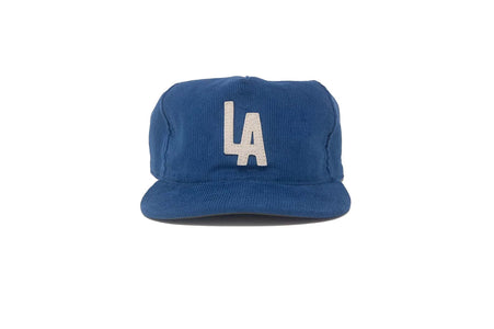 Front view of the blue LA City Series corduroy snapback with vintage-style white LA appliqué.