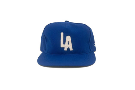 Blue unstructured stadium snapback hat with felt LA logo front view