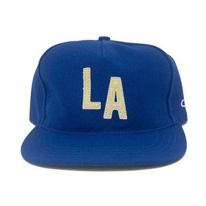 Los Angeles royal blue wool snapback hat with cream LA letter patch, flat brim, front view – The Simple Man