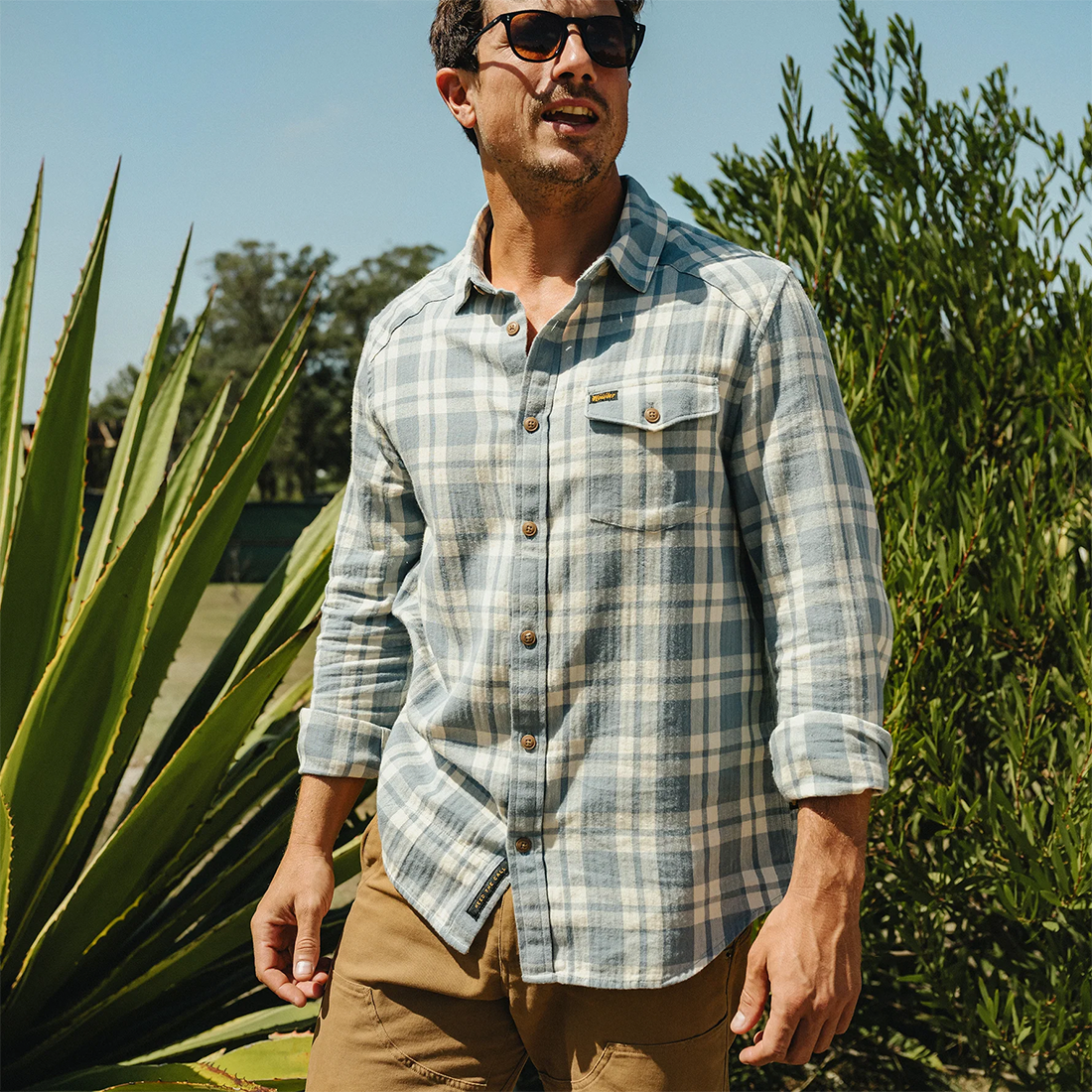 Man wearing the Cohen Plaid Iron Blue La Grange Lightweight Flannel outdoors with sleeves rolled, The Simple Man