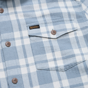 Close-up of the flap chest pocket, Howler woven label and brown coconut buttons on the Iron Blue La Grange Lightweight Flannel, The Simple Man