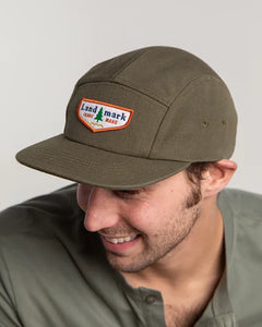 Model Wearing The Landmark Project scout cap in Olive Green front view