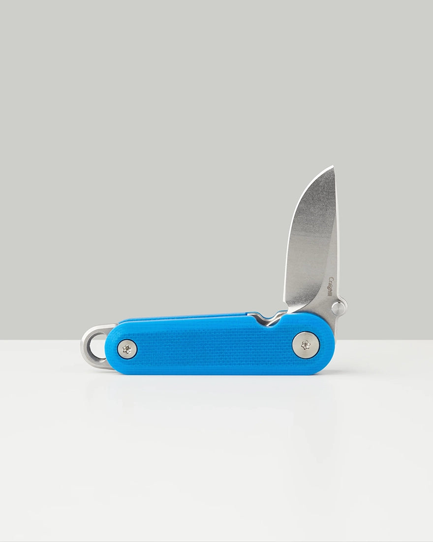 Compact blue G10 pocket knife with drop point blade and keyring loop