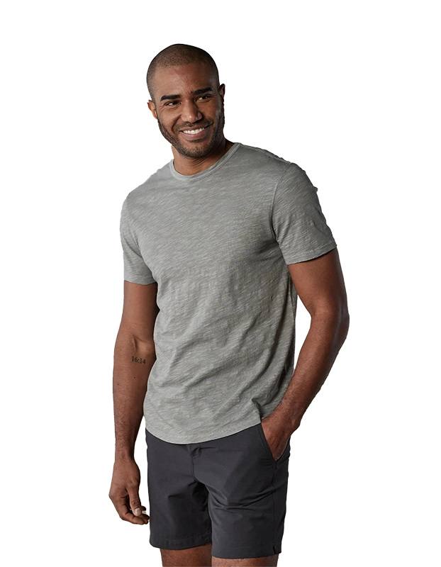 Model Wearing The Normal Brand Legacy Jersey Short sleeve t-shirt in greystone color, front view view