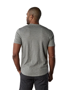 Model wearing The Normal Brand Legacy Jersey Short sleeve t-shirt in greystone color, rear view