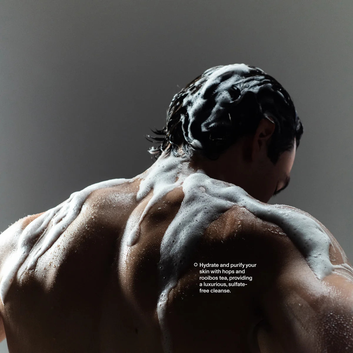 Man's back lathered with Blind Barber Lemongrass Tea Body Wash in the shower, sulfate-free cleanse, The Simple Man
